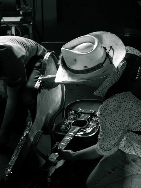 Guitar in its case backstage